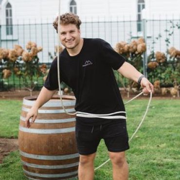 The Marquee & Co team with a wine barrel