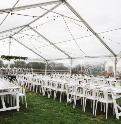 Tables and chairs inside the marquee